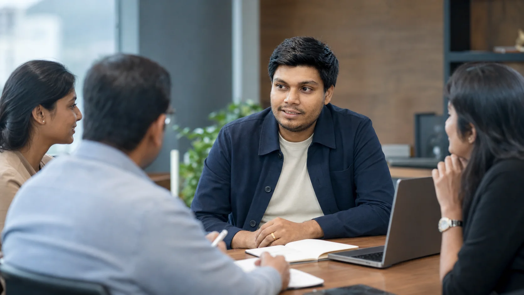 Kayen Akeel listening to Sri Lankan executives in a confidential meeting